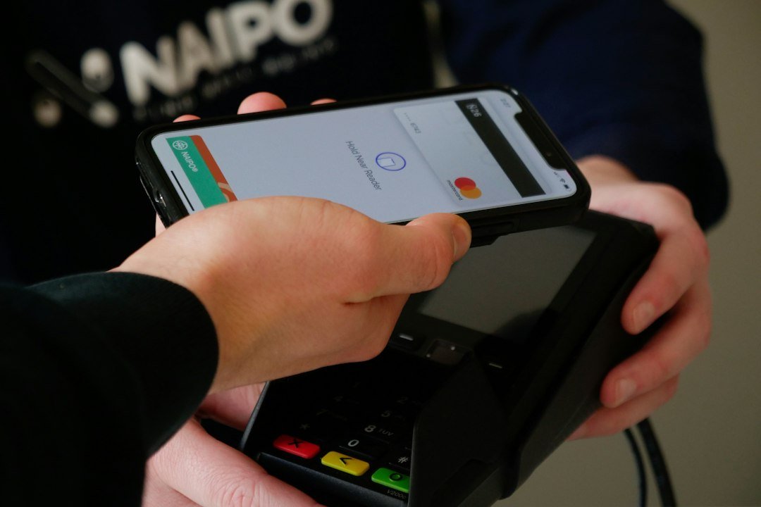 Person holding a smartphone to use a cashback app